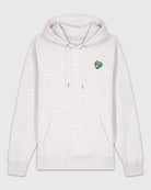 Hoodie gris clair chiné avec une broderie verte en forme de comprimé de B12 en coeur.