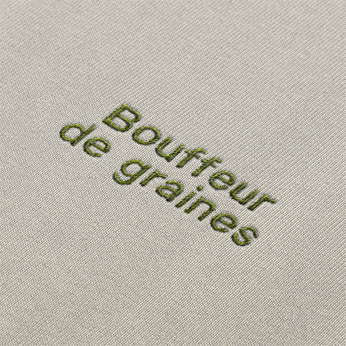 Détail de la broderie Bouffeuse de graines.